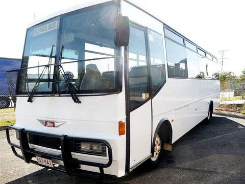 A white Hino bus parked outdoors, identifiable as model FD166 from the context.
